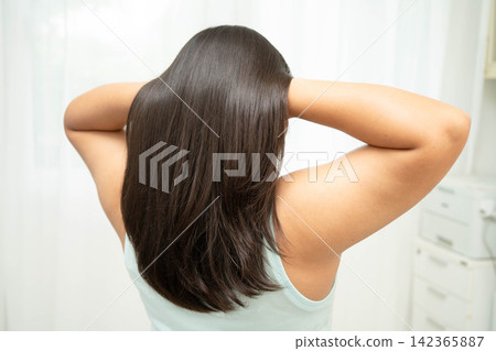 Woman with beautiful shine hair care treatment. Woman with beautiful shine hair care treatment. 142365887