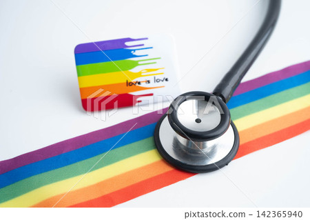 Stethoscope on LGBT rainbow flag, rights and gender equality. Stethoscope on LGBT rainbow flag, rights and gender equality. 142365940