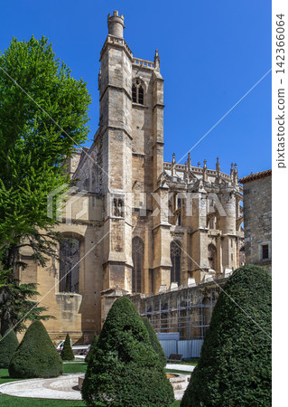 View from Jardin de l Archeveche of Narbonne Cathedral in France, featuring the tower. Gothic architecture in bright daylight View from Jardin de l Archeveche of Narbonne Cathedral in France, featuring the tower. Gothic architecture in bright daylight 142366064