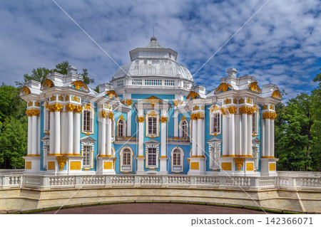 Front view of Hermitage pavilion in Tsarskoye Selo, Russia. Eye level view under a partly cloudy summer sky Front view of Hermitage pavilion in Tsarskoye Selo, Russia. Eye level view under a partly cloudy summer sky 142366071
