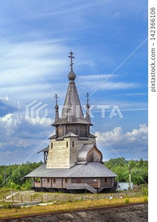 Wooden church of St Nicholas in Povenets, Russia front view. Traditional northern architecture, dark wood Wooden church of St Nicholas in Povenets, Russia front view. Traditional northern architecture, dark wood 142366106