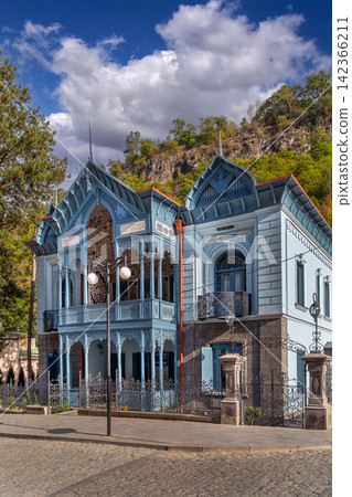 Historic Firuza Turquoise house in Borjomi town, Georgia. Beautiful wooden carving palace cultural architecture Historic Firuza Turquoise house in Borjomi town, Georgia. Beautiful wooden carving palace cultural architecture 142366211