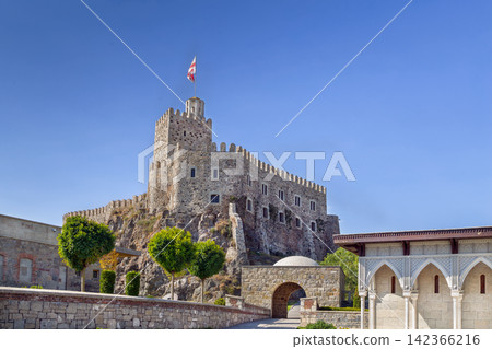 View of the main castle tower with flag in Rabati fortress, Georgia. Historic stone citadel medieval architecture. View of the main castle tower with flag in Rabati fortress, Georgia. Historic stone citadel medieval architecture. 142366216
