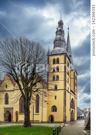 Side view of St Nicholas church in Lemgo, Germany. Winter afternoon cloudy overcast sky 142366391