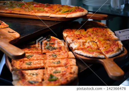 home made ellipse pan pizza on served home made ellipse pan pizza on served 142366476