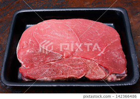 raw fresh beef knuckle steak cut on wood cutting board put on the hard wood table raw fresh beef knuckle steak cut on wood cutting board put on the hard wood table 142366486