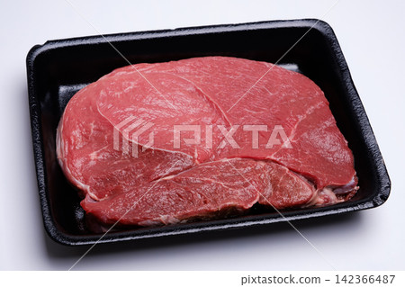 raw fresh beef knuckle steak cut in black tray isolated on white background raw fresh beef knuckle steak cut in black tray isolated on white background 142366487