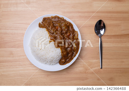top view of homemade Japanese curry rice with beef carrot beans and onion in white dish on wood table 142366488