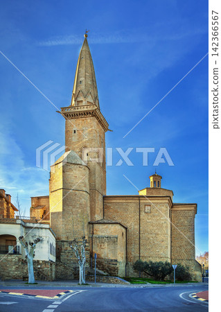 San Pedro Church tower in Olite, Spain, low angle view. Famous gothic needle spire and medieval religious architecture San Pedro Church tower in Olite, Spain, low angle view. Famous gothic needle spire and medieval religious architecture 142366567