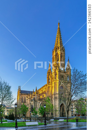 Cathedral of the Good Shepherd in San Sebastian, Spain. Three quarter exterior view. Sunny daylight, blue sky. Neo Gothic Cathedral of the Good Shepherd in San Sebastian, Spain. Three quarter exterior view. Sunny daylight, blue sky. Neo Gothic 142366583