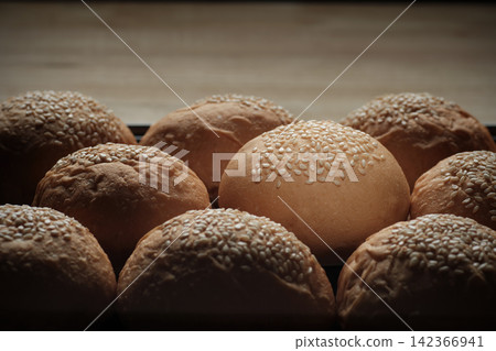 one perfect freshness sesame topping bun in spotlight among others berger breads on oven tray represent about concept of picking up a chosen perfect one one perfect freshness sesame topping bun in spotlight among others berger breads on oven tray represent about concept of picking up a chosen perfect one 142366941