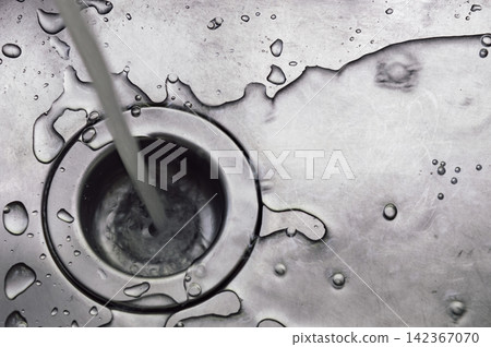 a wet dirty sink after washing many dishes photo may had noise and gain 142367070
