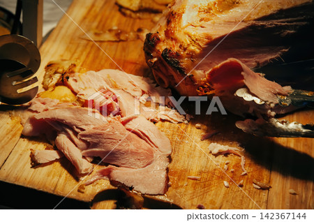 sliced pieces of a roasted chicken on wood cutting board ready to served for dinner party reception sliced pieces of a roasted chicken on wood cutting board ready to served for dinner party reception 142367144