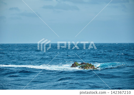 a natural rocks emerged in the open ocean name 'Richelieu Rock', one of the famous scuba diving site in Thailand a natural rocks emerged in the open ocean name 'Richelieu Rock', one of the famous scuba diving site in Thailand 142367210