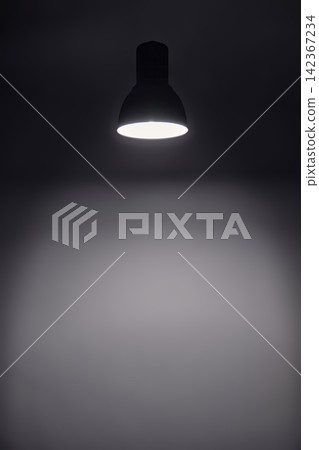 a shining levitating hanged ceiling lamp without electric wire with dark blue tone dirty concrete background wall a shining levitating hanged ceiling lamp without electric wire with dark blue tone dirty concrete background wall 142367234