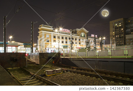 Savelovsky railway station (Savyolovsky, Savyolovskiy, Savyolovsky or Savelovskiy-- written in Russian) with the super moon -- is one of the nine main railway stations in Moscow, Russia (at night). Savelovsky railway station (Savyolovsky, Savyolovskiy, Savyolovsky or Savelovskiy-- written in Russian) with the super moon -- is one of the nine main railway stations in Moscow, Russia (at night). 142367380