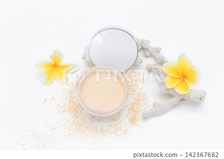 Soft powder spills from open container beside mirror. Yellow flowers add bright tropical flair. White coral fragment accents the clean minimalist scene. Ideal for beauty, skincare Soft powder spills from open container beside mirror. Yellow flowers add bright tropical flair. White coral fragment accents the clean minimalist scene. Ideal for beauty, skincare 142367682
