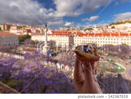 Pastel de Nata with Rossio Square View in Lisbon, Portugal Pastel de Nata with Rossio Square View in Lisbon, Portugal 142367810