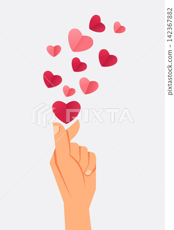 hand making mini heart gesture with paper heart shapes floating above hand making mini heart gesture with paper heart shapes floating above 142367882