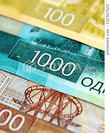 Russian ruble paper banknotes pile on table. Russia RUB currency money bills in big amount Russian ruble paper banknotes pile on table. Russia RUB currency money bills in big amount 142367920