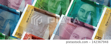 Gibraltar pound paper banknotes pile on table. Gibraltar GIP currency money bills in big amount Gibraltar pound paper banknotes pile on table. Gibraltar GIP currency money bills in big amount 142367948