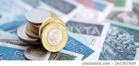 Coins and banknotes of Polish zloty and grosz currency. Poland PLN money close up. Business 142367989