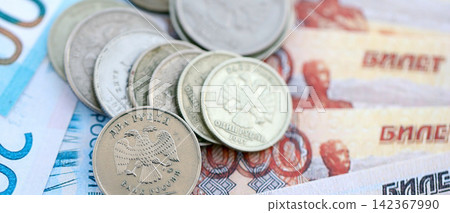 Coins and banknotes of Russian Federation ruble currency. Russia RUB money close up. Business Coins and banknotes of Russian Federation ruble currency. Russia RUB money close up. Business 142367990