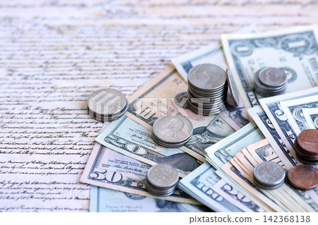 National Debt Ceiling Concept - US Constitution with different banknotes of Dollar Bills National Debt Ceiling Concept - US Constitution with different banknotes of Dollar Bills 142368138