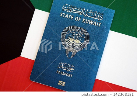 Kuwaiti passport on flag. The concept of citizenship Kuwaiti passport on flag. The concept of citizenship 142368181