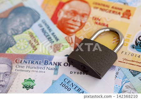 Nigerian naira currency money bills and padlock. The concept of sanctions and financial safety Nigerian naira currency money bills and padlock. The concept of sanctions and financial safety 142368210