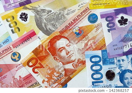 Philippines peso currency money bills. The current banknotes lies on table in big amount 142368257