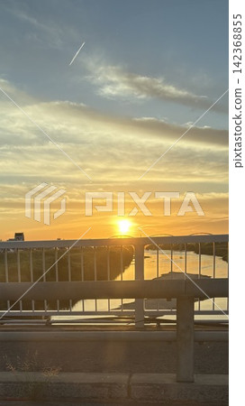 Sunset seen from the top of the bridge Sunset seen from the top of the bridge 142368855