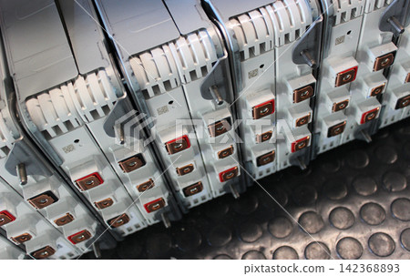 Identical blocks of an electric vehicle battery disassembled for diagnostics. Electric vehicle parts detailed Identical blocks of an electric vehicle battery disassembled for diagnostics. Electric vehicle parts detailed 142368893