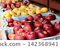 Apples in containers displayed in the store - 2 142368941