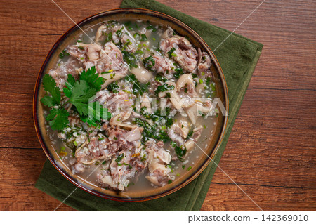 Muzhuzhi, a Georgian dish made from pork legs, with spices and herbs, homemade Muzhuzhi, a Georgian dish made from pork legs, with spices and herbs, homemade 142369010