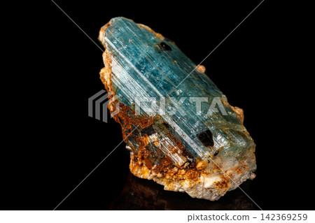 macro mineral stone aquamarine on a black background macro mineral stone aquamarine on a black background 142369259