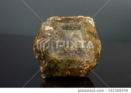 macro mineral stone Andradite on a black background macro mineral stone Andradite on a black background 142369349
