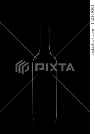 Beautiful bottle with glare on the sides on a black background, black on black Beautiful bottle with glare on the sides on a black background, black on black 142369361