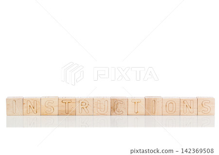 Wooden cubes with letters instructions on a white background 142369508