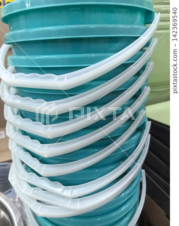 Stacked turquoise containers ready for use in a vibrant kitchen setting Stacked turquoise containers ready for use in a vibrant kitchen setting 142369540