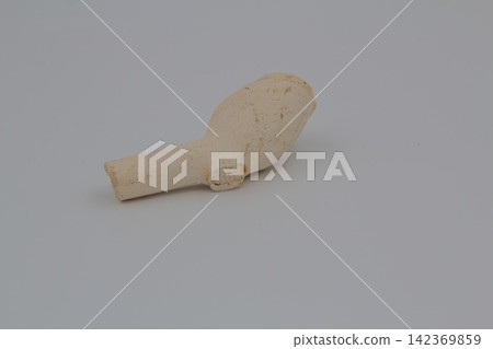Antique clay tobacco pipe fragment. Antique clay tobacco pipe fragment. 142369859