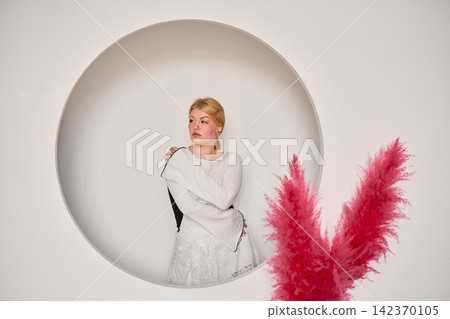 Graceful female performer exhibits poised motions quietly Graceful female performer exhibits poised motions quietly 142370105