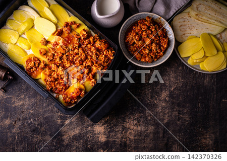 Moussaka with meat, eggplant and potato Moussaka with meat, eggplant and potato 142370326