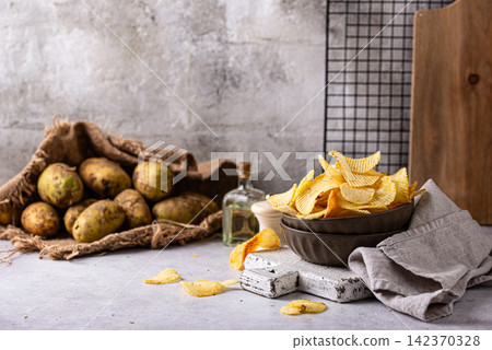 Crispy fresh potato chips, junk food Crispy fresh potato chips, junk food 142370328