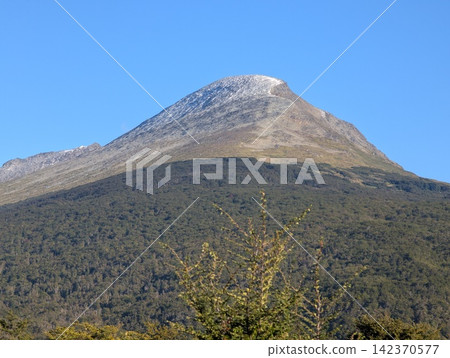 Dramatic Conical Mountain Peak in Tierra del Fuego Argentina Dramatic Conical Mountain Peak in Tierra del Fuego Argentina 142370577