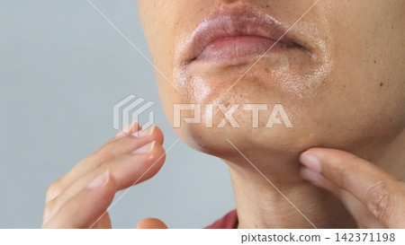 A man doing skin care A man doing skin care 142371198