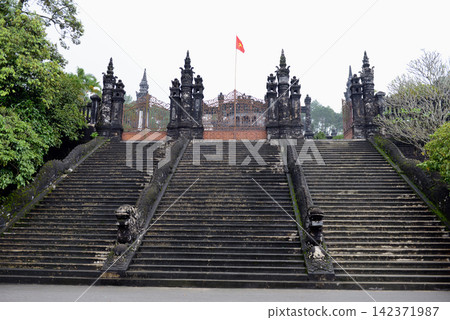 Vietnam Historic Temple Gate with Stone Staircase and Flag Vietnam Historic Temple Gate with Stone Staircase and Flag 142371987