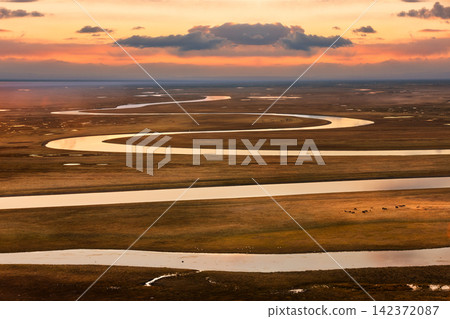 Aerial Meandering River Wetland at Golden Sunset Aerial Meandering River Wetland at Golden Sunset 142372087