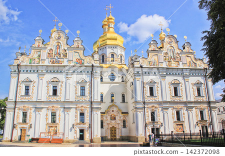 Orthodox Church with Golden Domes and Ornate Baroque Facade 142372098