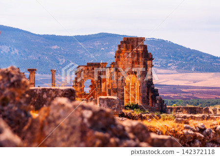 Ancient Roman Ruins with Stone Arches in Mountain Landscape Ancient Roman Ruins with Stone Arches in Mountain Landscape 142372118